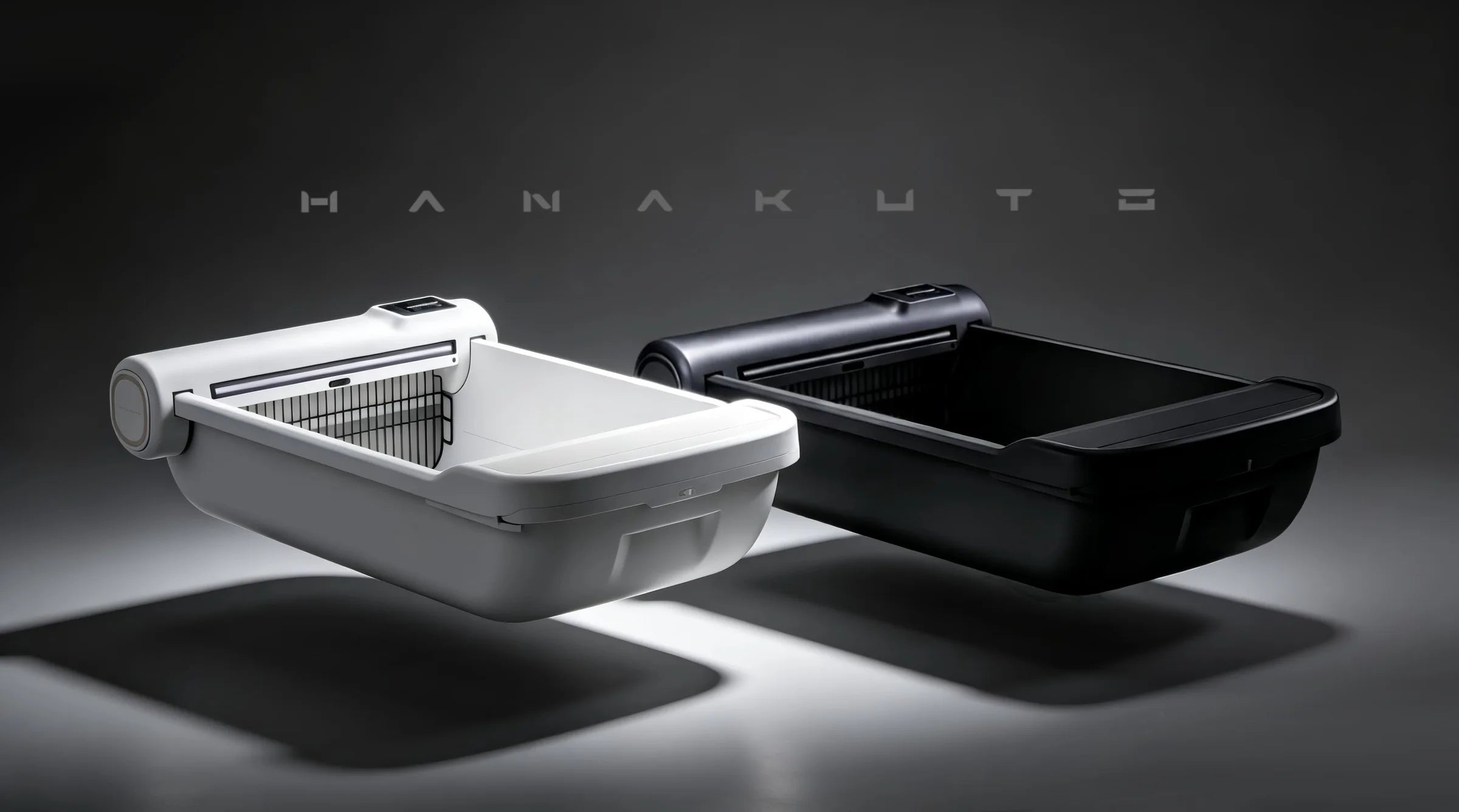 White and black Hanakuto smart litter boxes